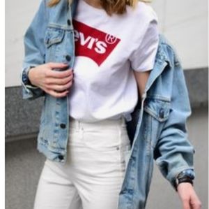 Womans Levis white shirt with red logo sz medium